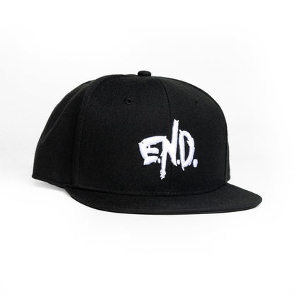 A black flat-brim snapback cap featuring a white embroidered &