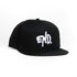 A black flat-brim snapback cap featuring a white embroidered &