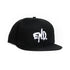 A black flat-brim snapback cap featuring a white embroidered &